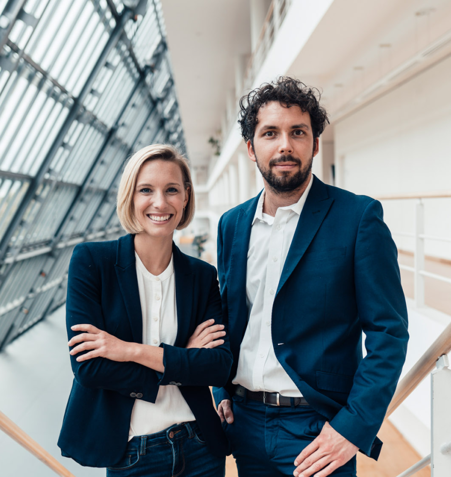 Image of male and female healthcare professionals smiling at camera.