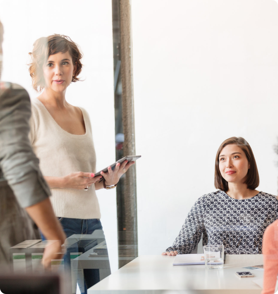 Image depicting three professionals collaborating at a HealthEdge US office.