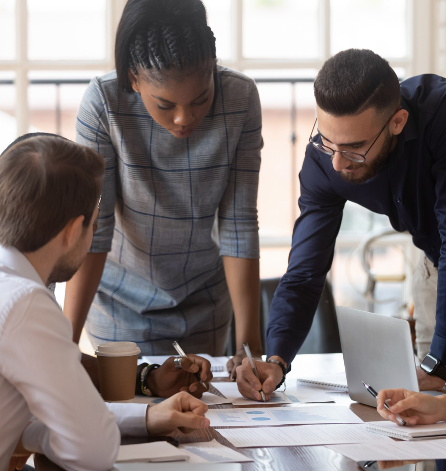 Image of diverse group of healthcare professionals collaborating in an office setting.