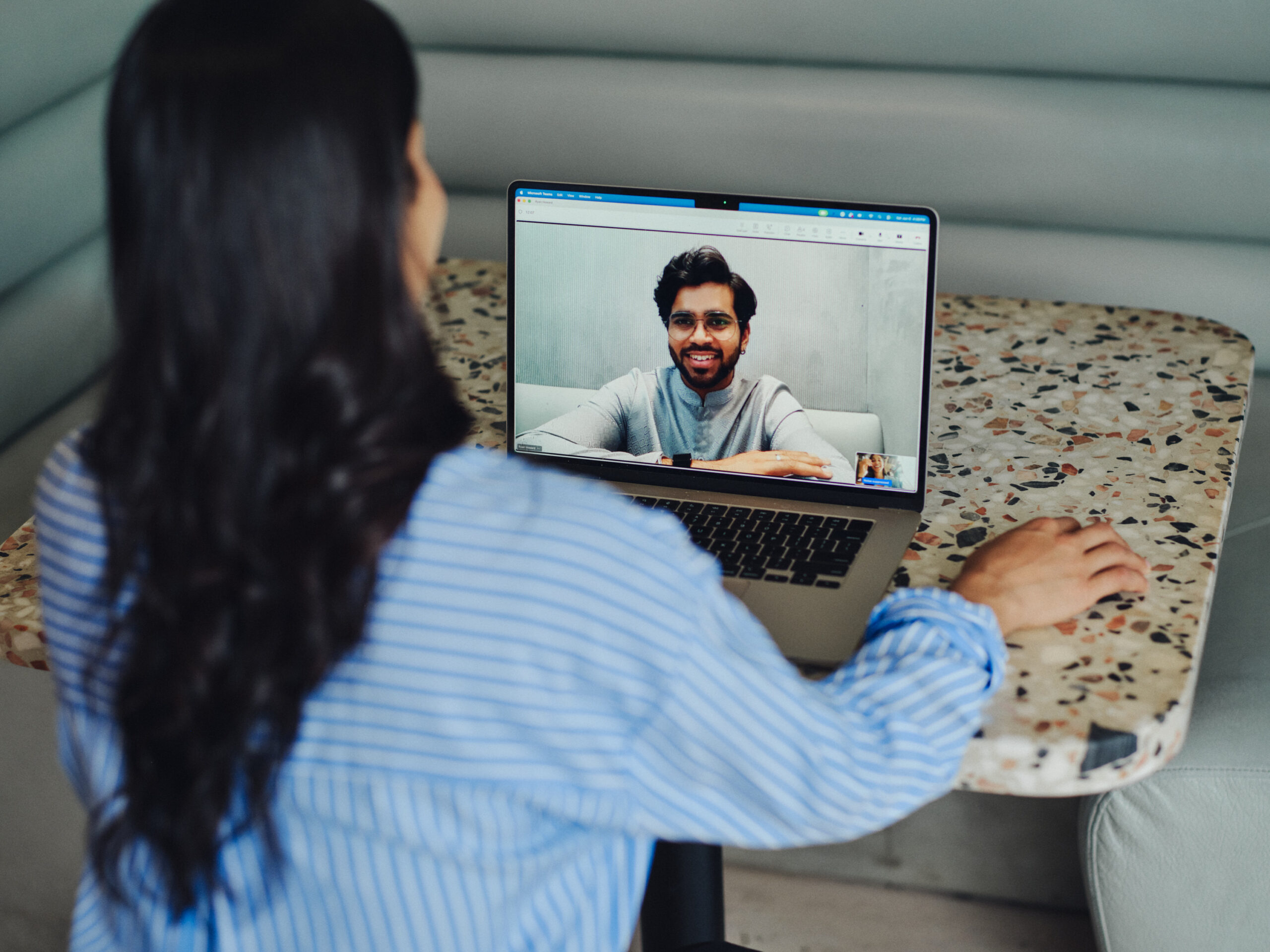 coworkers deep in conversation on video call